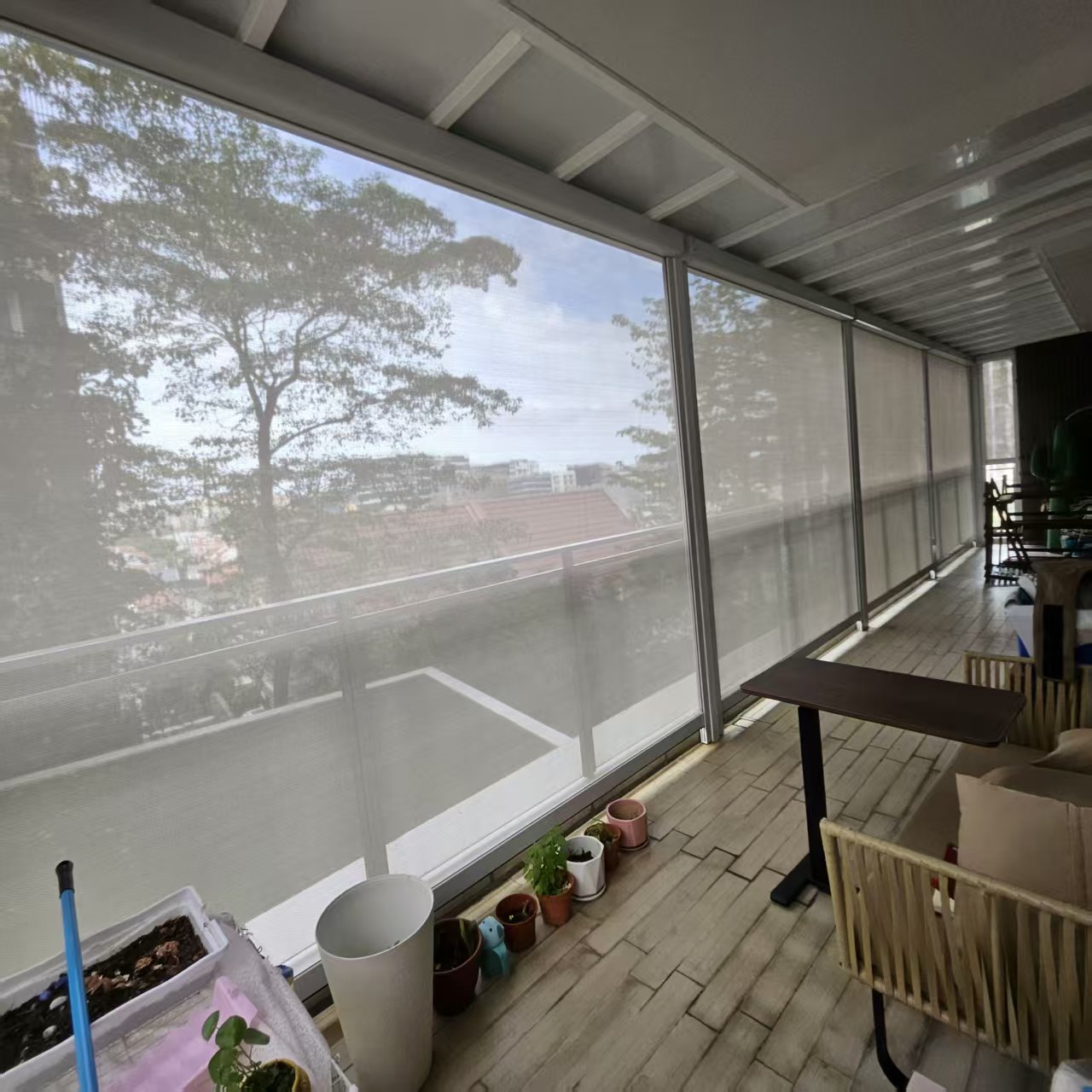 Balcony enclosed with motorised zip blinds